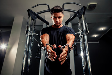 handsome man work out in gym on trainer