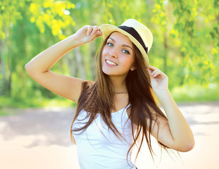 Summer fresh portrait of smiling young girl in hat outdoors, sun
