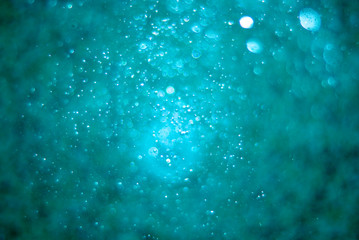 Bubbles in water macro shot, abstract image with bokeh
