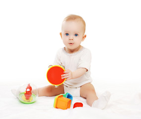 Fototapeta na wymiar Portrait of baby sitting and playing with colorful toys