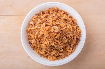 Deep fried shallots for garnishing in white bowl