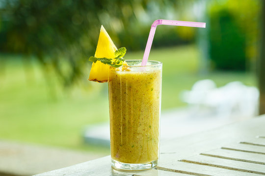 Smoothies of kiwi and pineapple on the table