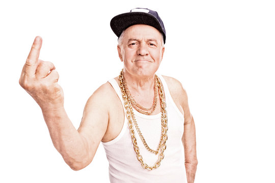 Senior man in hip-hop clothes, giving the finger