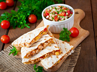 Mexican Quesadilla wrap with chicken, corn and salsa