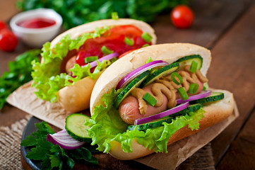 Hotdog with ketchup, mustard, lettuce and vegetables 