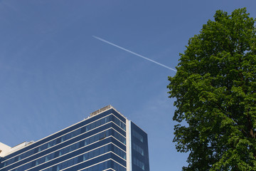 glass building and airplane