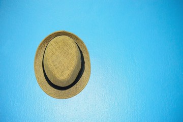 Vintage hat with black ribbon on blue