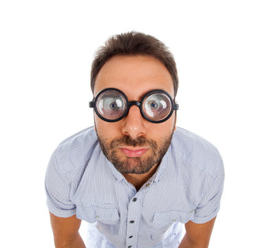 Man with a surprised expression and thick glasses