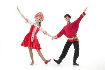 Dancing couple russian national costumes hold hands