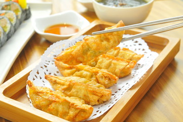Chinese food fried dumpling and dressing