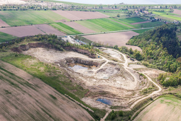 aerial view of rock quarry pond