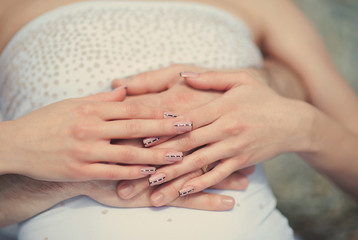 Hugs and hands of a beautiful young couple, love, lifestyle