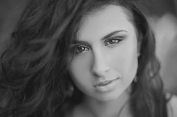Fototapeta premium Portrait of a beautiful brunette girl on the nature