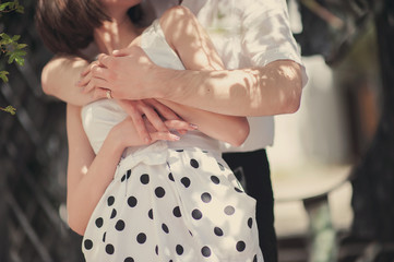 Hugs and hands of a beautiful young couple, love, lifestyle