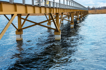 Steel bridge along river bank