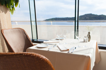 empty restaurant table with sea view