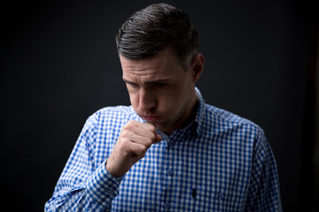 Fototapeta premium Portrait of a man coughing