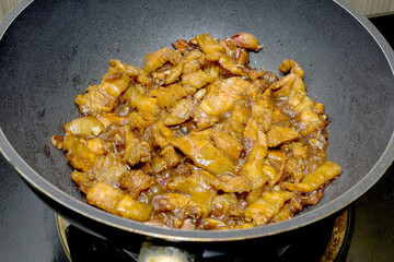Frying pork on sauce pan