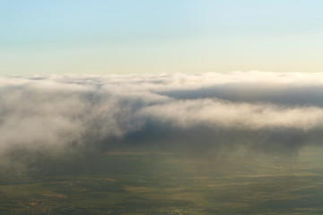 Plane crosses line clouds