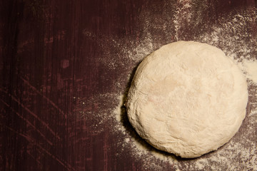 fresh the dough is ready for baking on wooden background