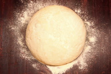 fresh the dough is ready for baking on wooden background