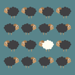 white sheep between black sheep. business concept
