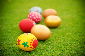 Fototapeta na wymiar easter eggs on the grass background