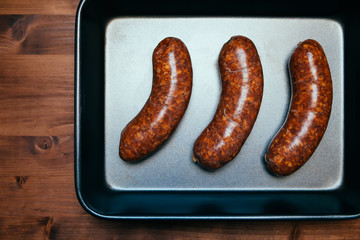 Gourmet sausages on the pan