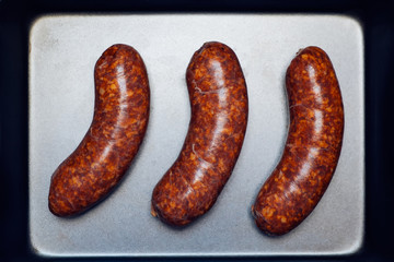 Gourmet sausages on the pan