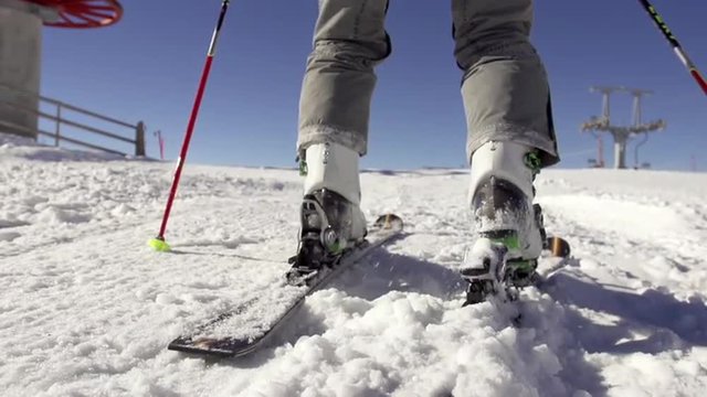 Slow Motion Of Attaching Ski Boots To Skis 