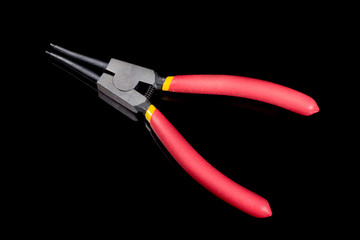 pliers on dark background