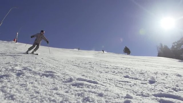 Beautiful Slow Motion Of Skier Skiing And Spraying Snow Powder All Over Camera