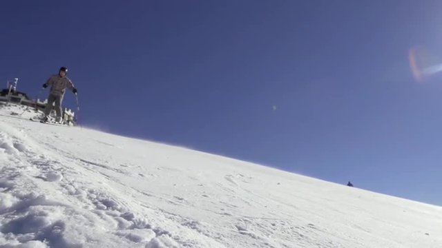 Sunny Slow Motion Of Professional Skier Carving Down The Slope In The Alps 