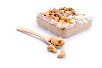 Assorted nuts in wooden spoon
