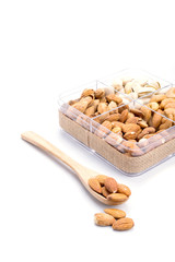 Assorted nuts in wooden spoon