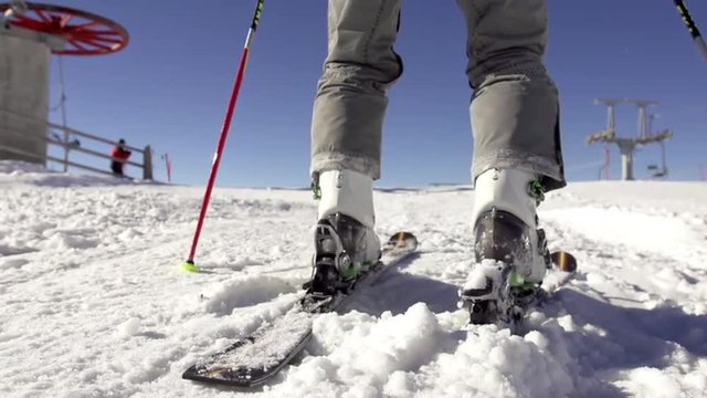 Slow Motion Of Attaching Ski Boots To Skis And Setting Off To Skiing 