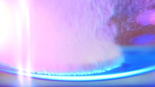Aspirin tablet drop into glass of water