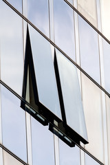 Fototapeta na wymiar glass facade with opened windows