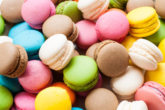 traditional french colorful macarons in a box, background