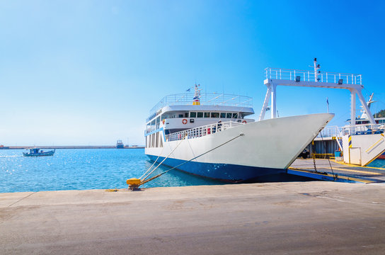 View of empty ferry in typical Greek blue white colors waiting i