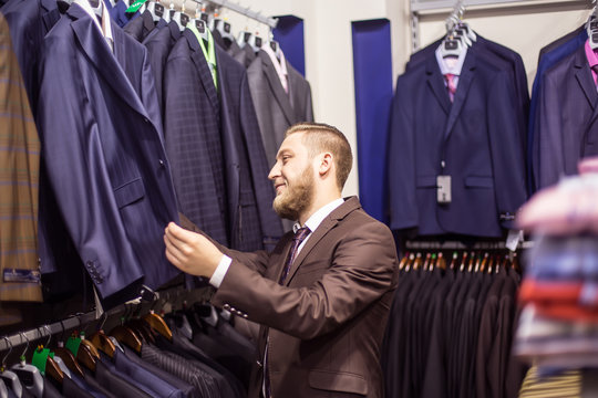 young man chooses suit