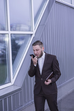 young businessman talking on the phon, aggressive