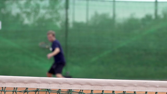 Slow Motion Of Playing Tennis With Focus On The Net