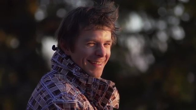 Portrait Shot Of Smiling Sportsman Lifting Thumb Up Outdoors In Nature