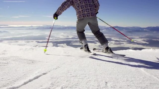 Amazing Slow Motion Of Skier Carving Over Camera On Sunny Winter Day