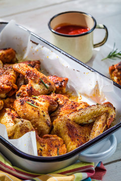 Crispy chicken wings with herbs and sauce