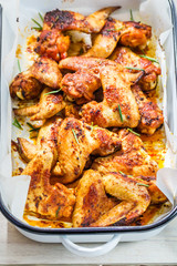 Hot chicken wings in rustic kitchen
