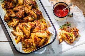 Homemade chicken wings in summer kitchen