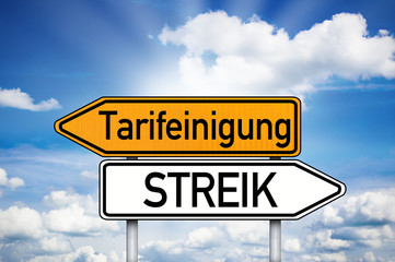 Wegweiser mit Tarifeinigung und Streik