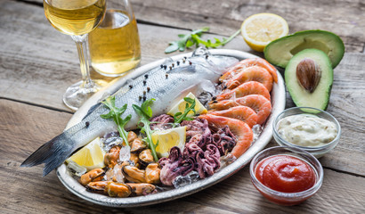 Fresh seabass with seafood on the tray